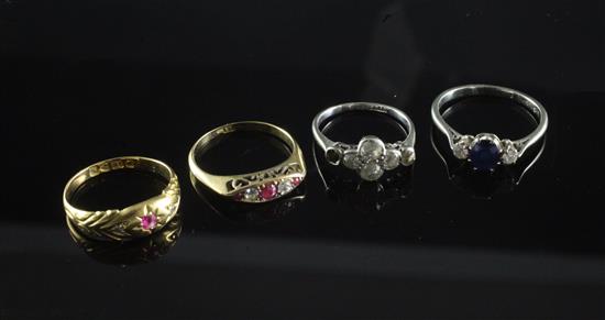 Four early 20th century 18ct gold and gem set rings, various sizes.